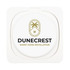 A wireless charger with a circular design featuring the logo for Dunecrest Smart Home Installation.