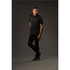 A black polo shirt with a subtle striped design, worn by a model against a dark background. The shirt features a logo.