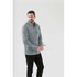 A man wearing a grey unisex fleece shacket with front pockets, set against a light background.