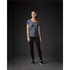 A woman stands in a navy blue crew neck t-shirt and black leggings, with a subtle logo on the shirt.