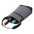 A drink bottle cooler in grey fabric, featuring two compartments for bottles and a black strap.