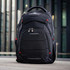 A black backpack with red accents, featuring multiple compartments and a logo on the front.