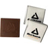 A chocolate square in brown with a cocoa pod design, accompanied by two silver wrappers featuring a logo.