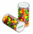 Two clear tubes filled with colourful Skittles in red, green, yellow, orange, and purple, featuring a branding logo.