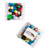 A clear bag contains an assortment of brightly coloured chocolate beans, featuring blue, green, red, yellow, white, and black.