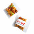 A clear packet containing a mix of nuts and crunchy snacks, featuring various shades of brown and green. It has a logo on the front.