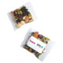 A clear pouch containing a colourful mix of nuts, seeds, and dried fruits, labelled with branding.