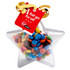 A clear acrylic star filled with colourful M&Ms, topped with a ribbon and a tag.
