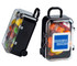 A black carry-on case containing colourful Skittles, featuring a logo on the front. 