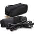 A lightweight folding chair in a black storage bag, with disassembled frame pieces visible alongside.