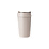 A drink bottle featuring a light beige double wall design made from wheat straw, with a lid and no visible branding.
