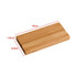 A bamboo wireless power bank in natural wood colour, measuring 15cm x 6.9cm x 1.6cm, with a logo.