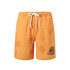 Orange men's swim shorts featuring a leaf pattern and a logo, made from polyester and spandex.
