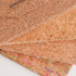 Foldable cork glasses case in natural cork with a textured finish, featuring colourful abstract patterns on one side.
