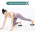 A pair of black yoga sliding disks with a person in a light purple outfit using them in a workout.