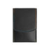A black portable manicure set with coloured stitching, featuring a smooth exterior and a flap closure.