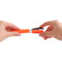 A pair of multifunctional scissors in orange, being held by two hands, showcasing a compact design.