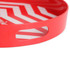 A red serving tray with a zigzag pattern and two cut-out handles. It has a glossy finish.