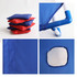 A blue portable cornhole game board with red and blue bean bags stacked beside it. It has a circular hole and piping details.