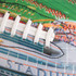 A colourful promotional American football featuring white laces and a detailed design of a stadium.