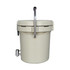 A cream-coloured ice bucket with a faucet and a silver handle, featuring a logo on the side.