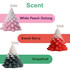 Christmas tree-shaped candles in pink, red, and green, featuring scents like White Peach Oolong, Sweet Berry, and Grapefruit.
