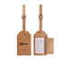 A cork luggage tag featuring a natural cork surface, a leather strap, and a pocket for information.