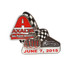 A hard enamel lapel pin featuring a racing theme with red, black, and silver colours, and a checkered flag design.