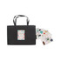 A black paper bag with a knitted handle and a decorative label, accompanied by assorted stickers.