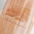 A wooden wine box featuring an engraved design and branding, showcasing natural wood colour and a smooth finish.