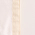 A close-up of a cream-coloured reusable linen bread bag with a textured edge and faint seam detailing.