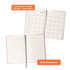 A B5 notebook with a cardboard cover, featuring monthly calendar pages and lined pages, in a pink and white colour scheme.