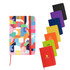 A colourful PU A6 notebook with a geometric design, accompanied by solid-coloured notebooks in various shades.