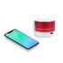 A red metal Bluetooth speaker beside a smartphone displaying a green gradient screen. The speaker features control buttons.