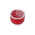 A red metal Bluetooth speaker with a textured circular top and control buttons at the base, featuring a logo.