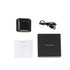 A black charging case with true wireless earbuds, a USB charging cable, and a user manual on a flat surface.