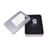 A large silver tin case with a transparent window, containing a black item on cushioned black foam.