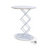 A backlit LED spring-up display table in white with a round top and a collapsible scissor mechanism.