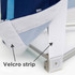 A close-up of a Velcro strip attached to the corner of a fabric display panel in blue and white.