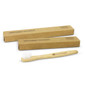 A bamboo toothbrush with a wooden handle and white bristles, displayed alongside two kraft packaging boxes.