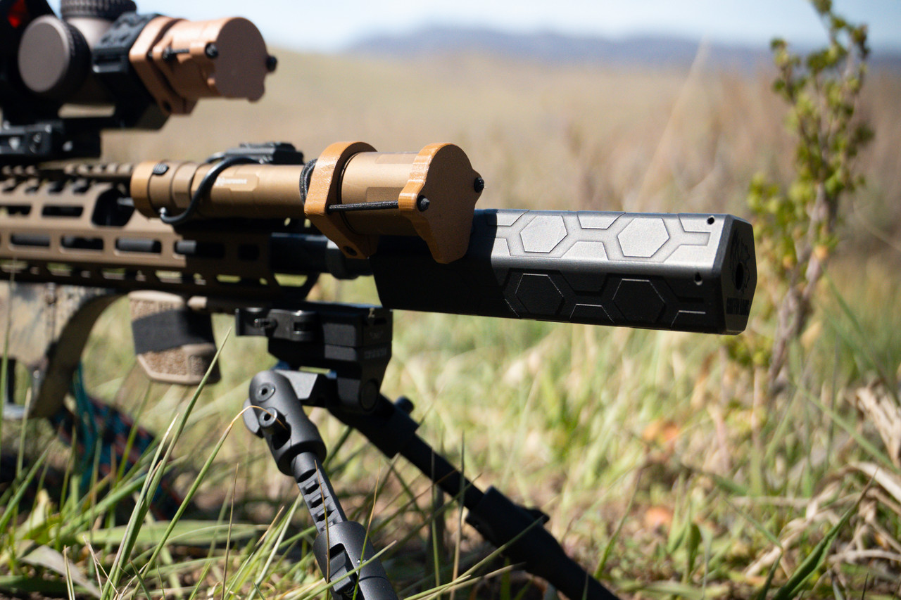 The Unorthodox Suppression Smokey Suppressor mounted on an AR-15 platform rifle.