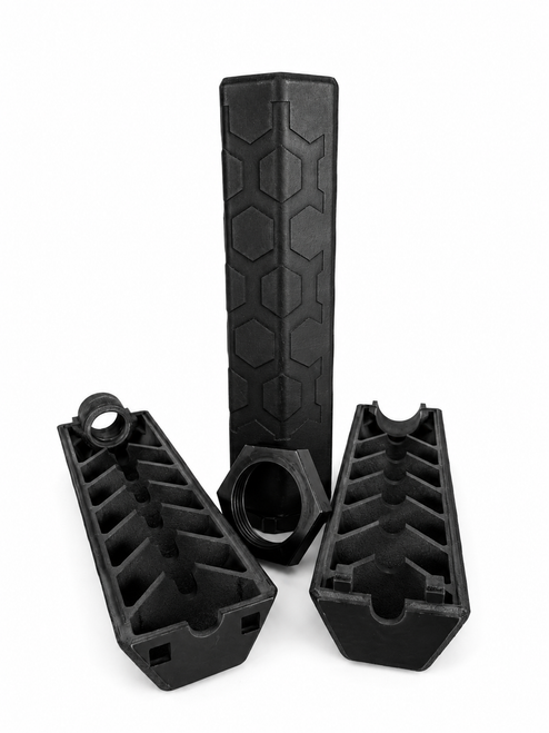The split titanium suppressor, showing how easily it opens for cleaning its baffles.