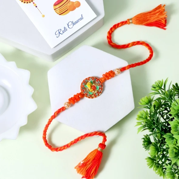 Ganesha Rakhi Representing wisdom, prosperity, and protection, this Rakhi is a perfect way to send blessings and love to your brother with delivery available across the UK.