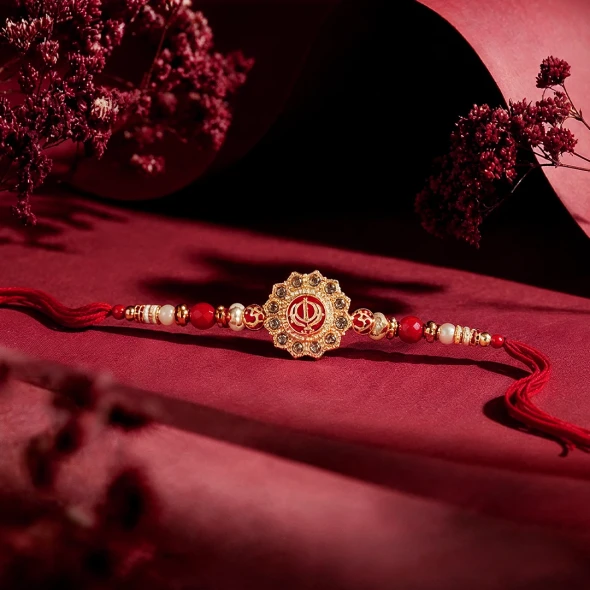 Honour the bond of siblings with the sacred Khanda Rakhi — a deeply meaningful Rakhi featuring the Khanda symbol, the emblem of the Sikh faith representing divine strength, courage, and protection.