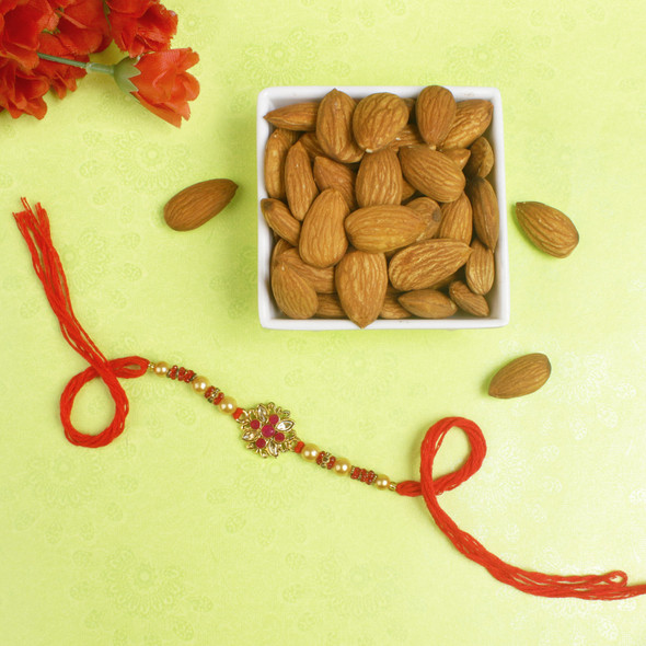 Appealing Pink Diamond Rakhi with Almond Nuts - For UK
