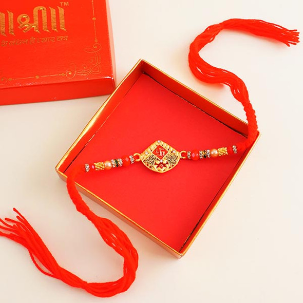 Golden Swastik Rakhi with Sweets & Dryfruit Combo - For INDIA