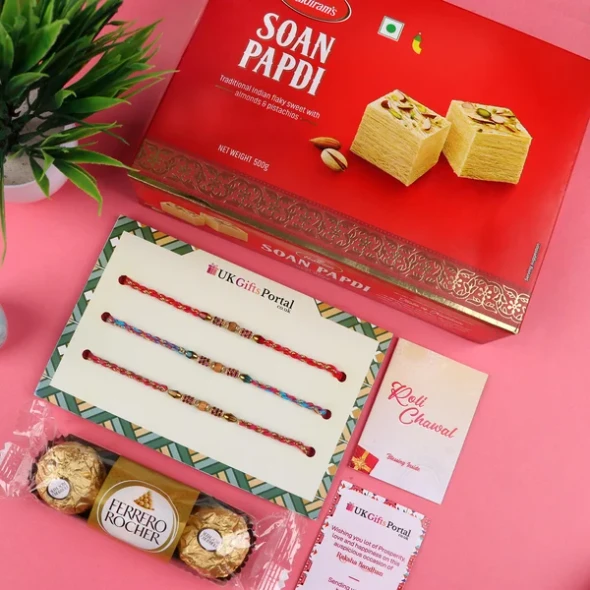 Appealing 3 Rakhi Set with Soan Papdi & 3 Pcs Ferrero - For USA