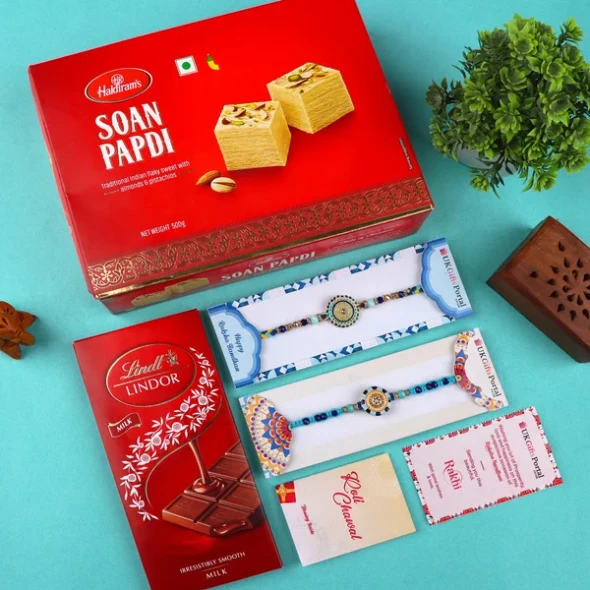 Floral Blue Rakhi Set with Soan Papdi & Lindt - For USA
