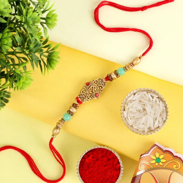 Send your brother the blessings of the sacred Aum symbol this Raksha Bandhan with this beautifully crafted Aum Rakhi, available for UK delivery.

⚠️ Issues to Fix First
Before the SEO content, two things need urgent attention:

Page title mismatch — The <title> tag reads "Pink Diamond Rakhi - For UK" but the product is Aum Rakhi. This is likely a BigCommerce template/copy-paste error and will confuse Google significantly. Fix it immediately in the admin.
Meta keywords tag also says "Three Beads Evil Eye Rakhi" — same wrong product data carrying over. Update this too.


?️ Alt Text (All 4 Images)
ImageOptimised Alt TextMain product (U2)Aum Rakhi for UK – Sacred OM Designer Rakhi with Free UK DeliverySecondary product (U2-A)Aum Designer Rakhi for Brother – UK Raksha Bandhan Gift from LondonWish CardRaksha Bandhan Wish Card included with Aum Rakhi – UK Gifts PortalRoli ChawalComplimentary Roli Chawal Pack for Raksha Bandhan Puja – UK Delivery

? SEO Product Description
Send your brother the blessings of the sacred Aum symbol this Raksha Bandhan with this beautifully crafted Aum Rakhi, available for UK delivery