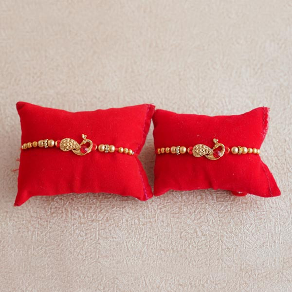 Two Peacock Rakhis with Mewa Bites and Doda Barfi - For INDIA